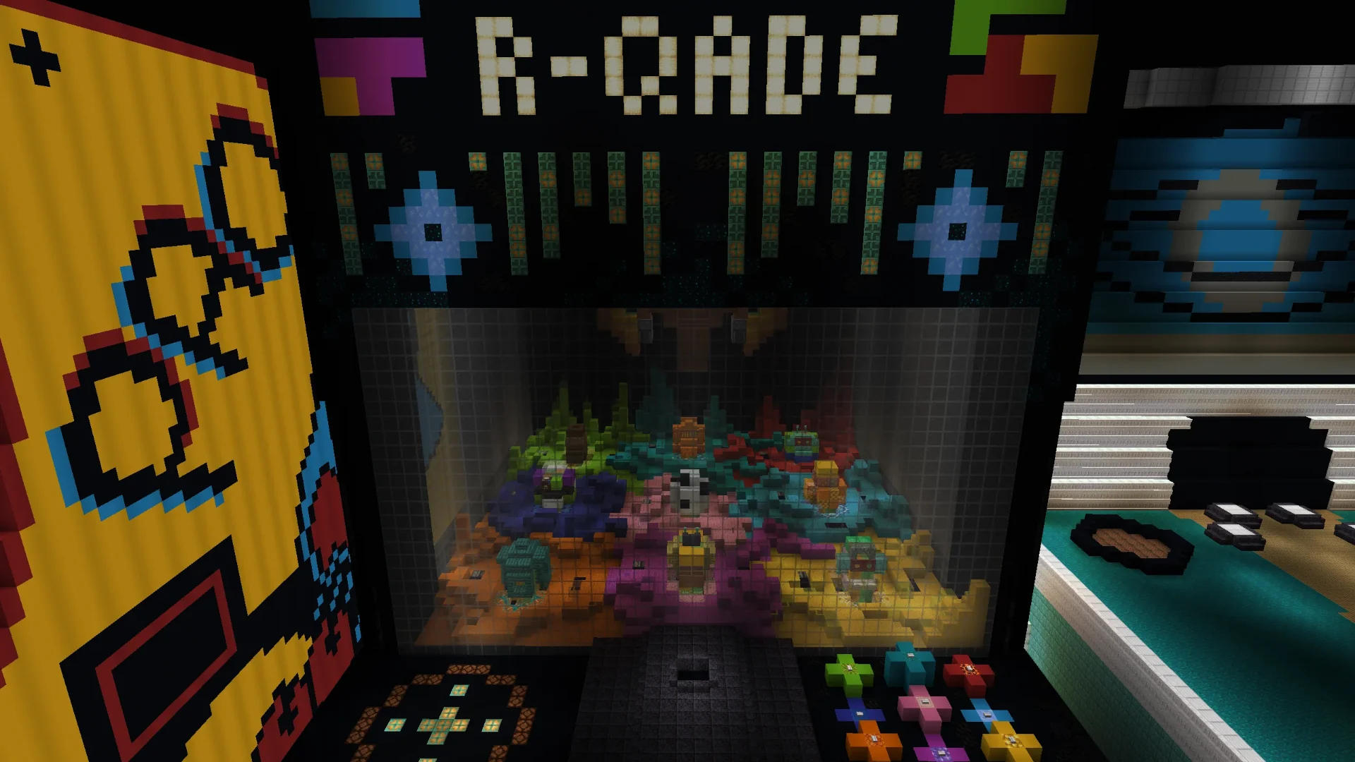 The R-QADE arcade claw machine cabinet in vanilla Minecraft, its glass prize pit full of colourful toys
