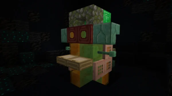 The monkey prize — a green and orange figure with wide eyes and outstretched arms