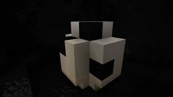 The soccer ball prize — a white and black blocky ball in the claw machine pit